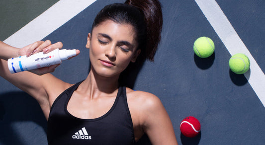 A lady showing sunscreen for the oily skin