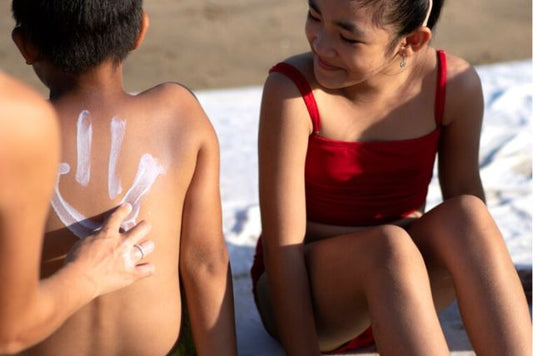 teenager using sunscreen